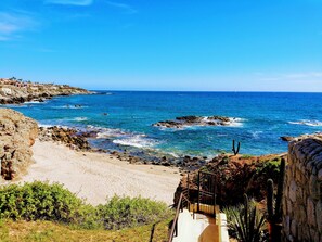 On the beach, sun loungers, beach towels