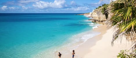 On the beach, sun-loungers, beach towels