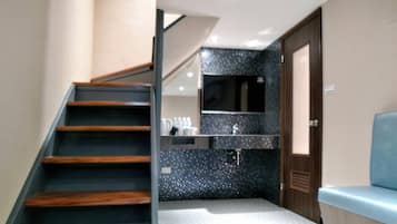 Quadruple Room | Living area | 50-inch LED TV with cable channels, TV