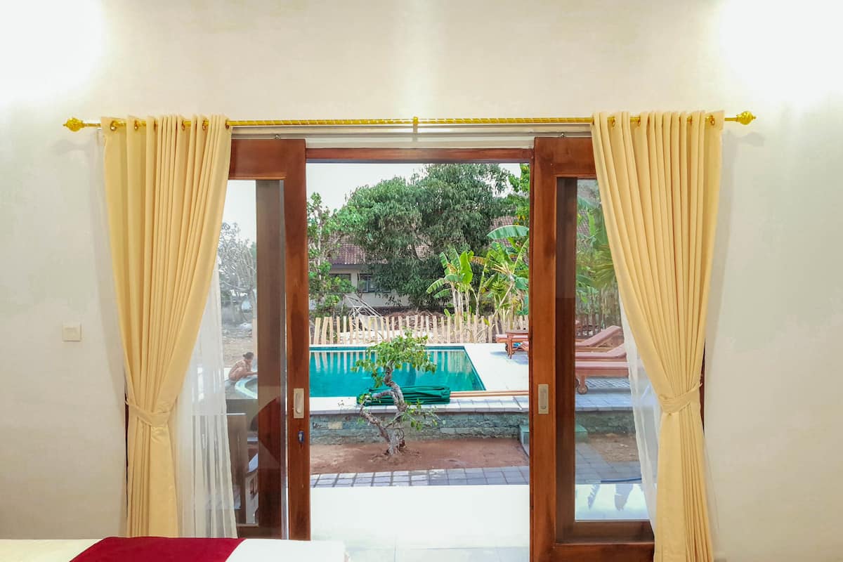 Quarto casal luxo, vista para a piscina | Vista do quarto