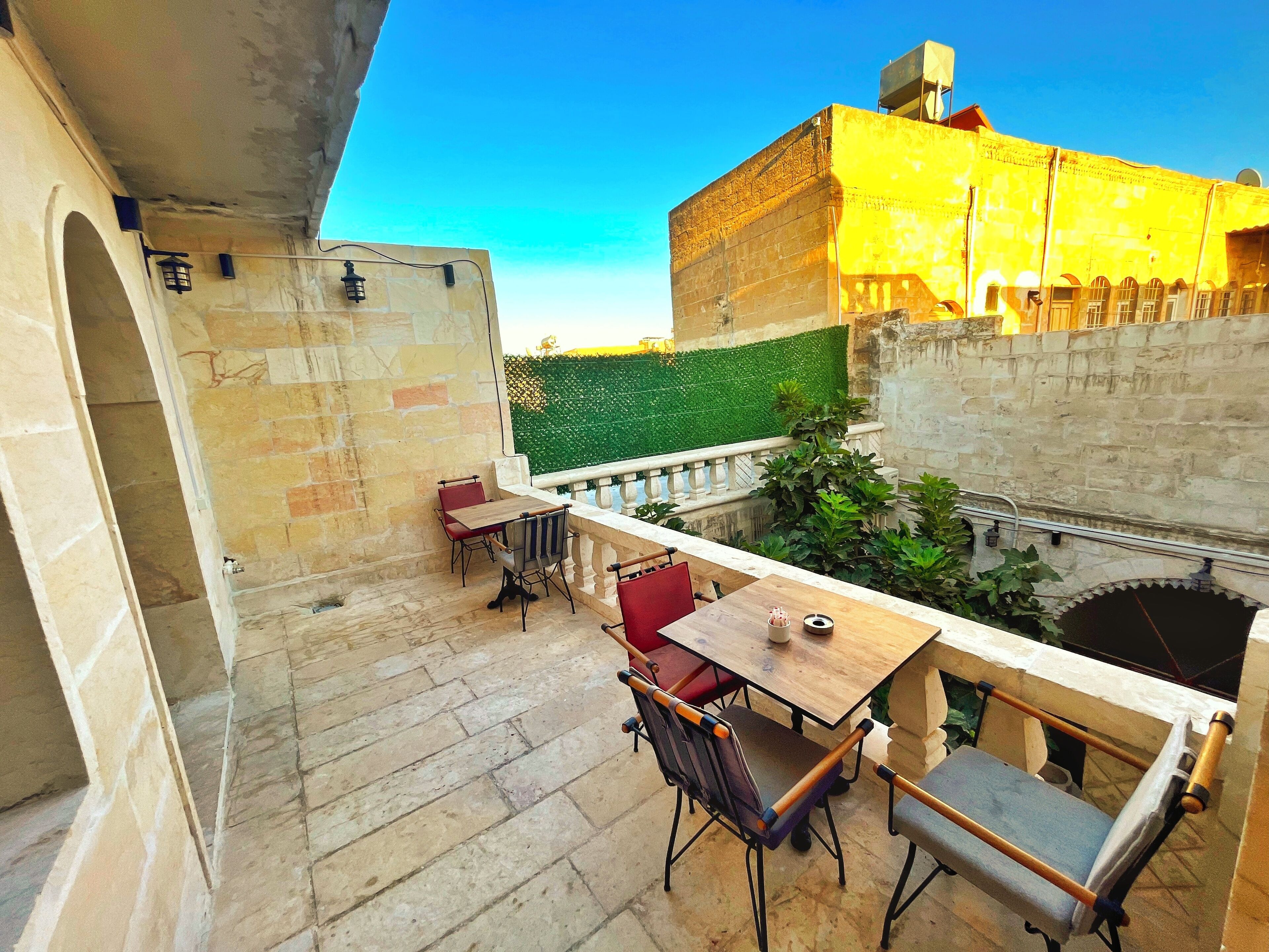 family room, multiple beds | terrace/patio