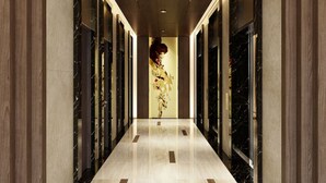 A hallway with a polished marble floor, flanked by dark wooden panels and black marble accents. - Ami Splendid Rivergate Views (Ho Chi Minh City)