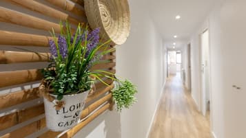 Apartment, 2 Bedrooms | Living area | 65-inch TV with cable channels