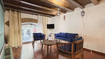 Apartment (2 Bedrooms) | Living area | 65-inch TV with cable channels