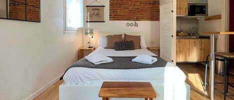 Apartment (0 Bedroom) | Living area | 65-inch TV with cable channels