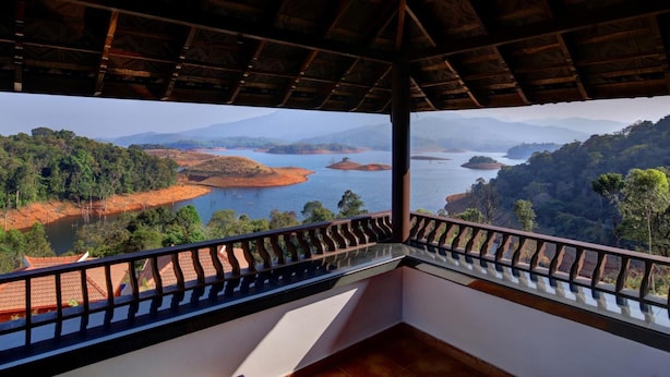 A room with a view of a lake surrounded by hills. - Contour Island Resort & Spa (Vythiri)