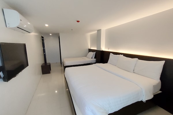 Family Room | Desk, iron/ironing board, bed sheets