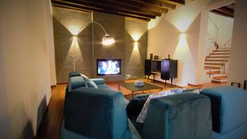Deluxe Villa, 4 Bedrooms | Living room | Flat-screen TV