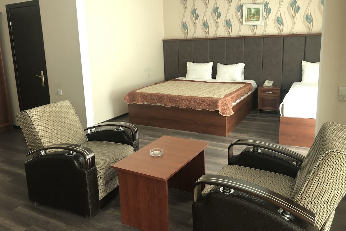 Family Triple Room | Minibar, in-room safe, desk, blackout curtains