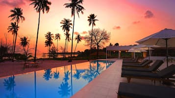 Outdoor pool, open 7:00 AM to 11:00 PM, pool umbrellas, sun loungers