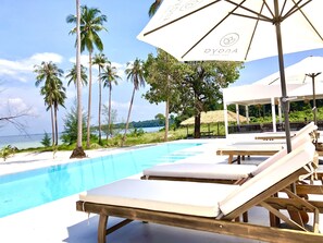 Outdoor pool, open 7:00 AM to 11:00 PM, pool umbrellas, sun loungers