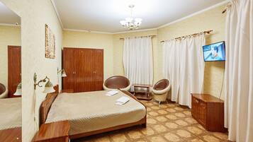 1 chambre, minibar, bureau, fer et planche à repasser