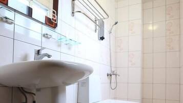 Shower, free toiletries, hair dryer, slippers