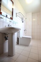 Shower, free toiletries, hair dryer, slippers