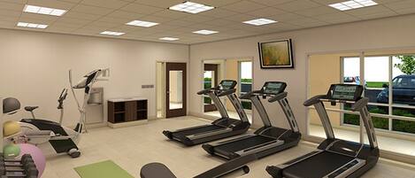 A fitness room with treadmills, a stationary bike, and a rowing machine.