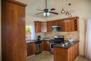 Villa (4 Bedrooms) | Private kitchen | Oven, stovetop, espresso maker, cookware/dishes/utensils