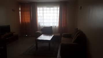 Apartemen | Area keluarga | TV layar datar