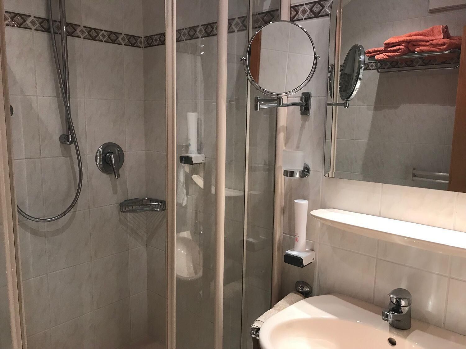 shower, free toiletries, hair dryer, towels