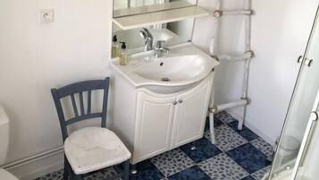 Shower, towels, soap, toilet paper