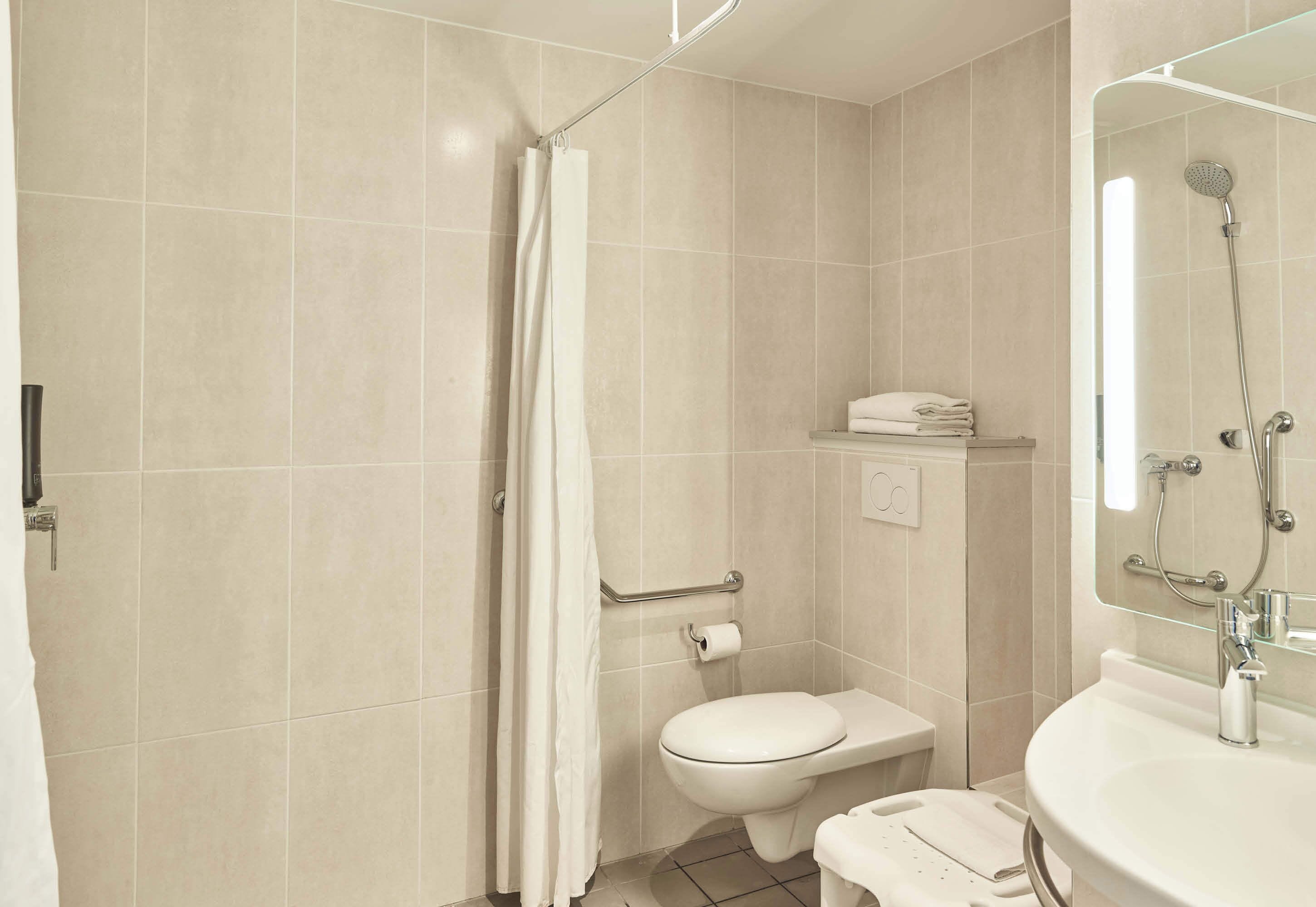 double room, mobility accessible | bathroom | shower, towels, soap, toilet paper