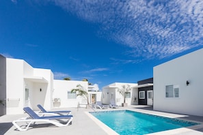 Outdoor pool, open 8:00 AM to 10:00 PM, sun loungers
