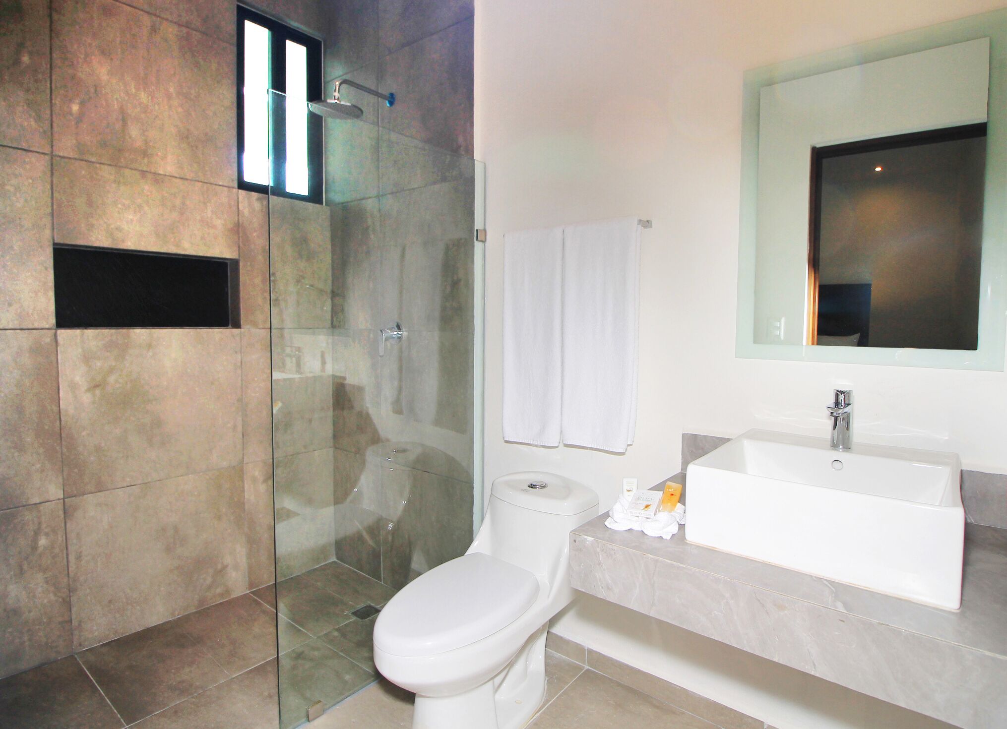 double suite | bathroom | shower, rainfall showerhead, hair dryer, towels