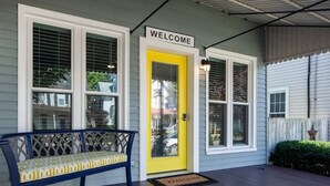 A porch with a bench, a yellow door, and a 'WELCOME' sign. - Hersheypark 3.4 miles-Open floor plan (Hummelstown)