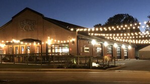 A building with a sign reading "Rubber Soul" and string lights along the exterior. - Hersheypark 3.4 miles-Open floor plan (Hummelstown)