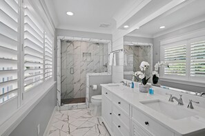 Shower, hair dryer, towels, soap