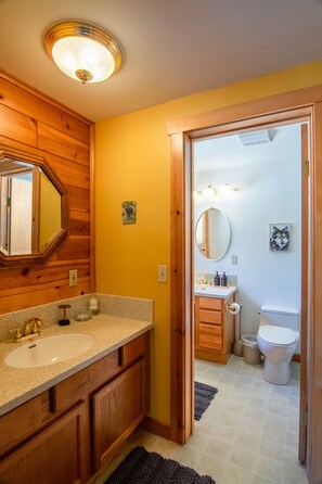 Bathtub, hair dryer, towels, soap