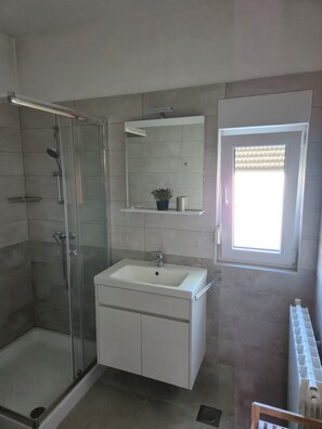 Shower, hair dryer, towels, soap