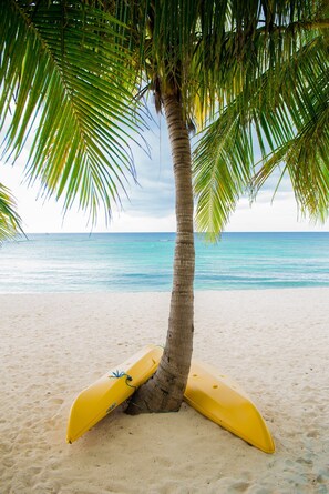On the beach, sun-loungers, beach towels