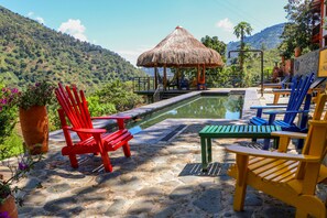 Outdoor pool, open 7:00 AM to 8:00 PM, pool umbrellas, pool loungers