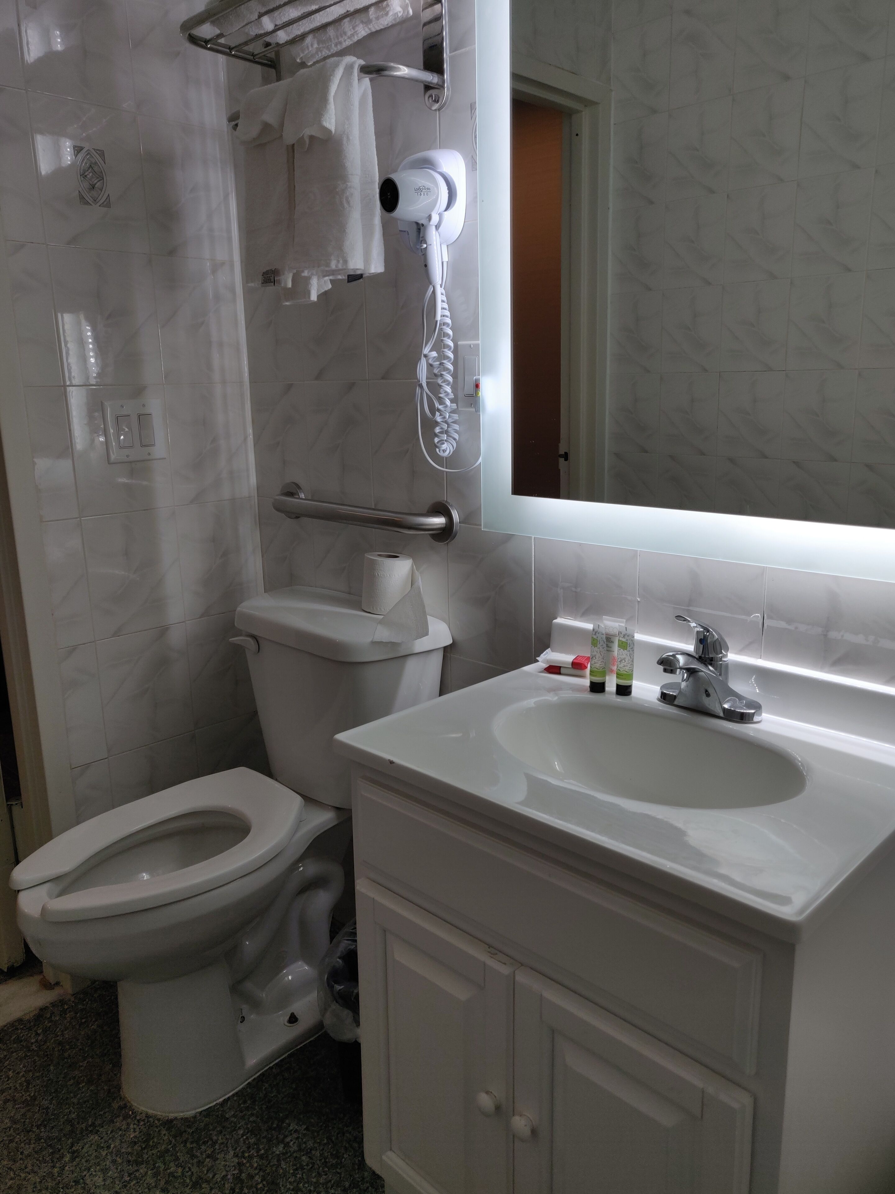 classic room | bathroom | rainfall showerhead, hair dryer, towels, soap