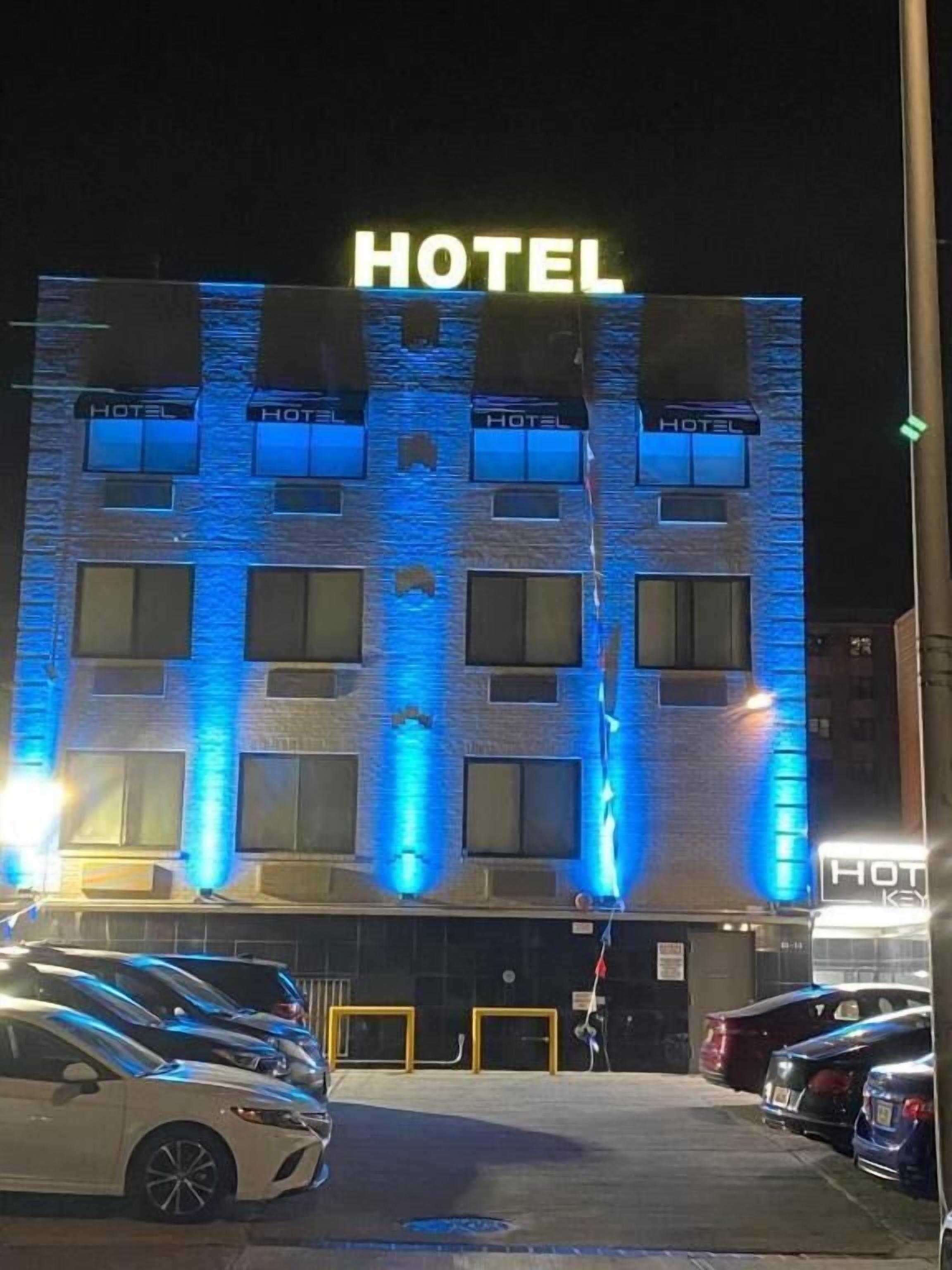 A hotel with a prominent 'HOTEL' sign at the top.