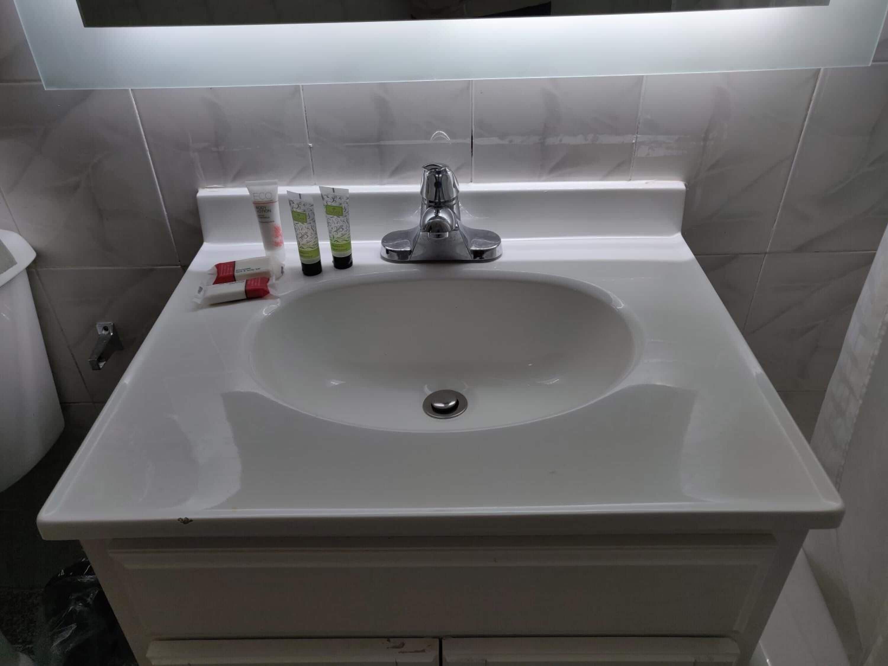 rainfall showerhead, hair dryer, towels, soap