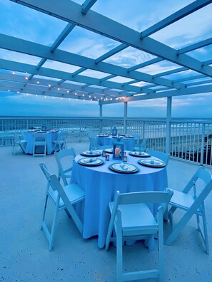 Outdoor dining - BEAUTIFUL LUXURY OCEANFRONT HOME!!! Sleeps 25, Elev, pool & rooftop deck. 7B/7B. (Ocean Isle Beach)