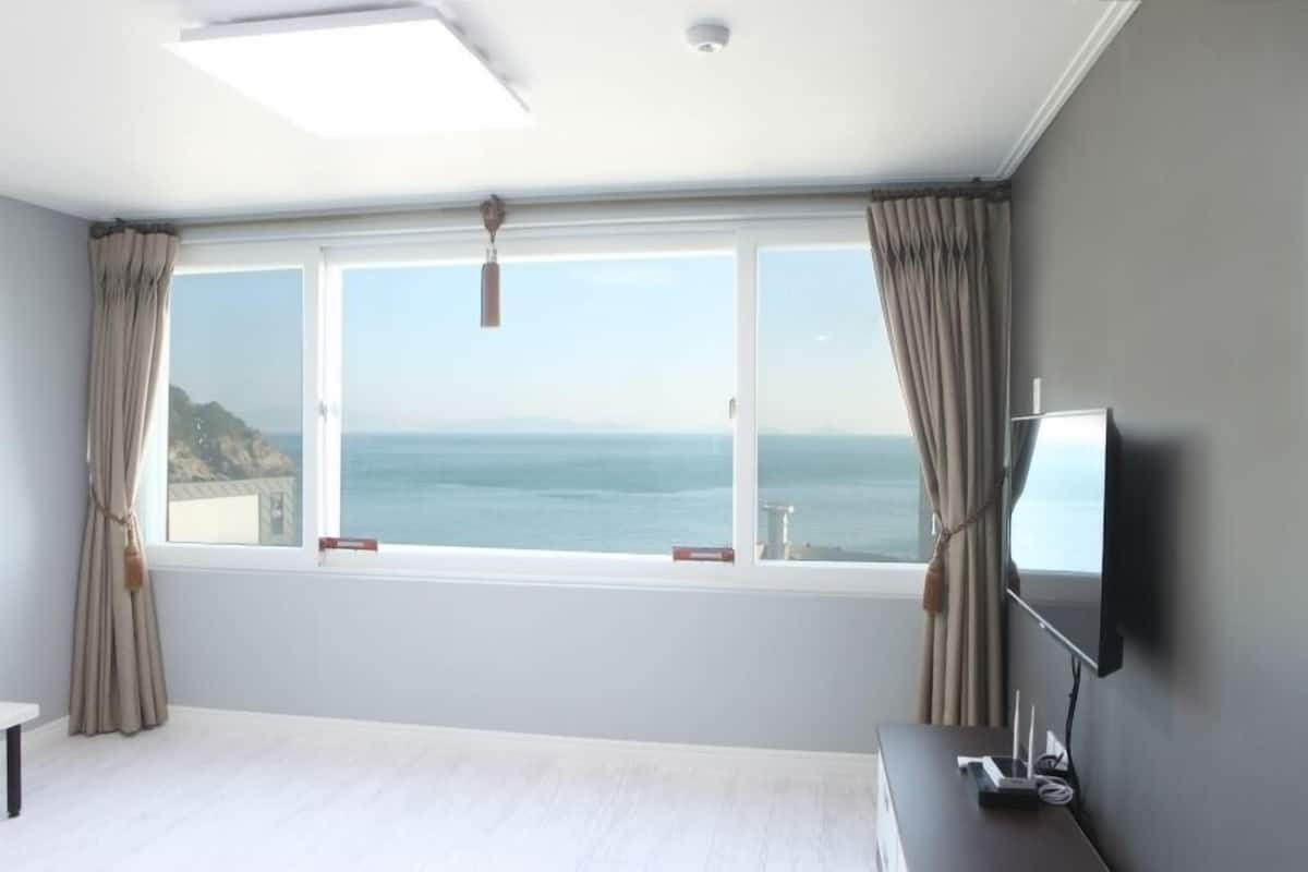Condo, Ocean View (Double B) | Living area | Flat-screen TV