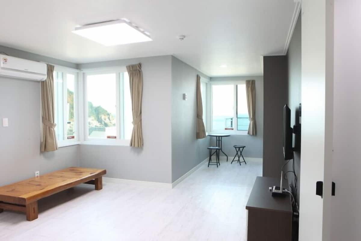 Condo, Ocean View (Ondol C) | Living area | Flat-screen TV