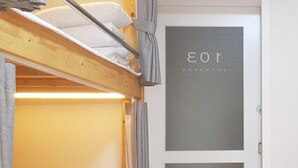 A bunk bed with a headboard, a door with frosted glass panels, and a curtain. - Sudabang Guesthouse - Hostel (Mokpo)