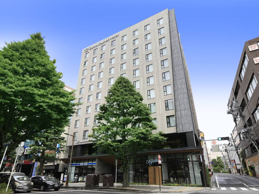 A tall hotel building with multiple floors and a modern design.