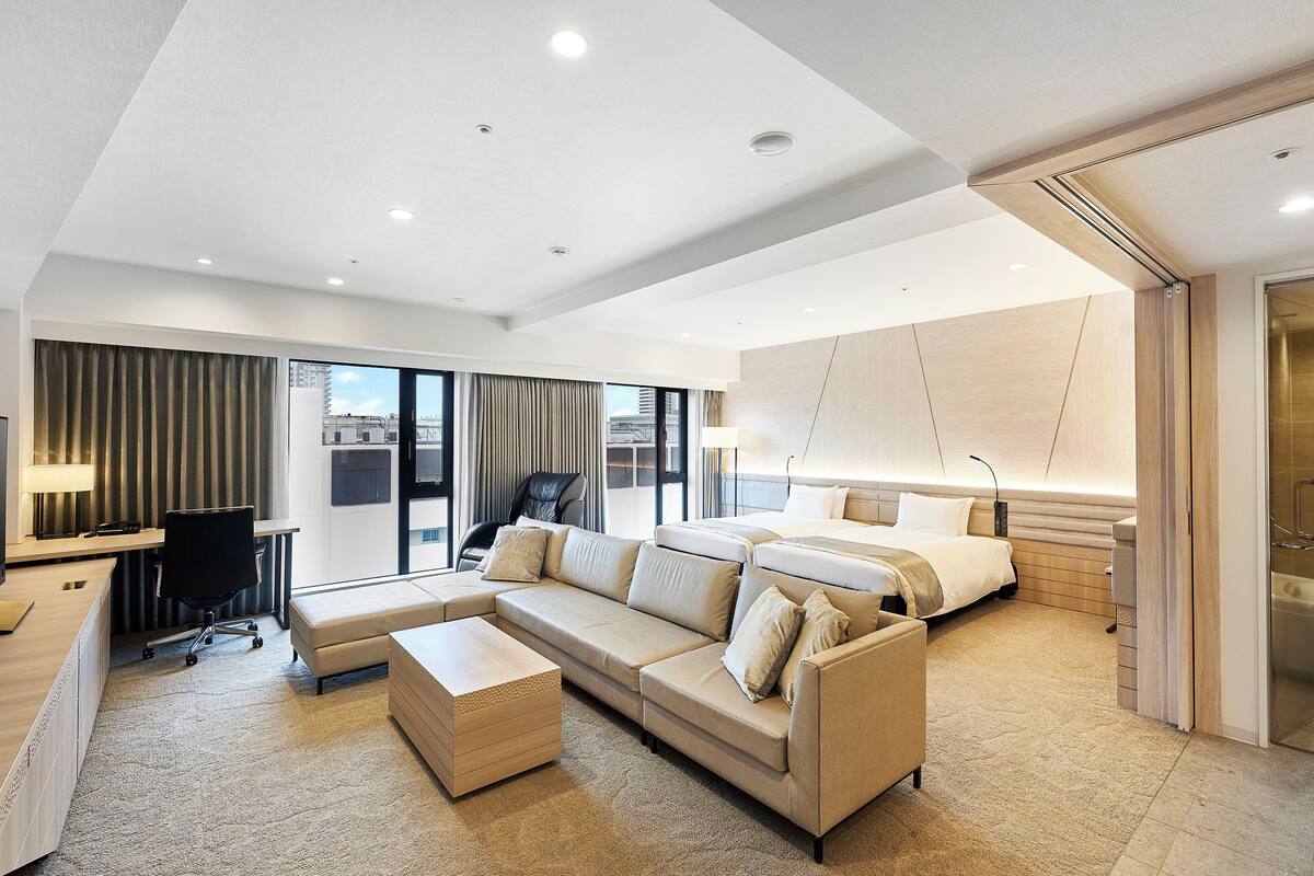 junior suite room - non-smoking | in-room safe, desk, laptop workspace, blackout curtains