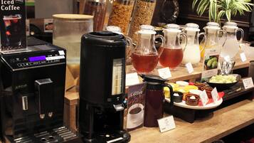 A coffee station with multiple coffee makers, a variety of coffee beans, and a selection of beverages.