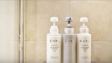 Three Stephen Knoll Collection bottles on a bathroom counter.