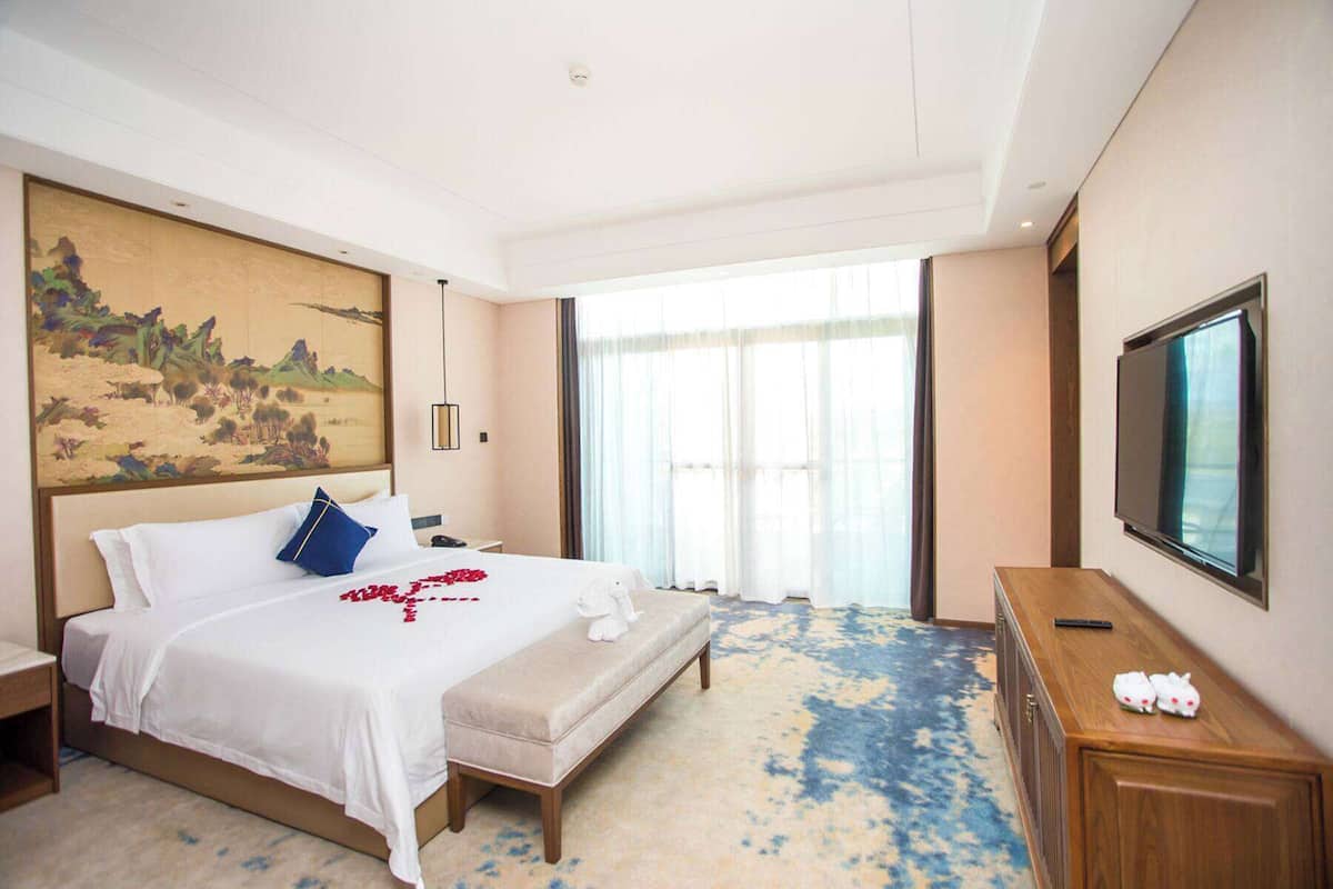 Suite Deluxe, fumadores | Ropa de cama y accesible en silla de ruedas