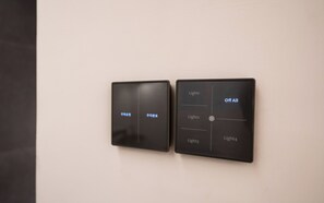 Two wall-mounted control panels with labels for light switches. - H hotel (Seoul)