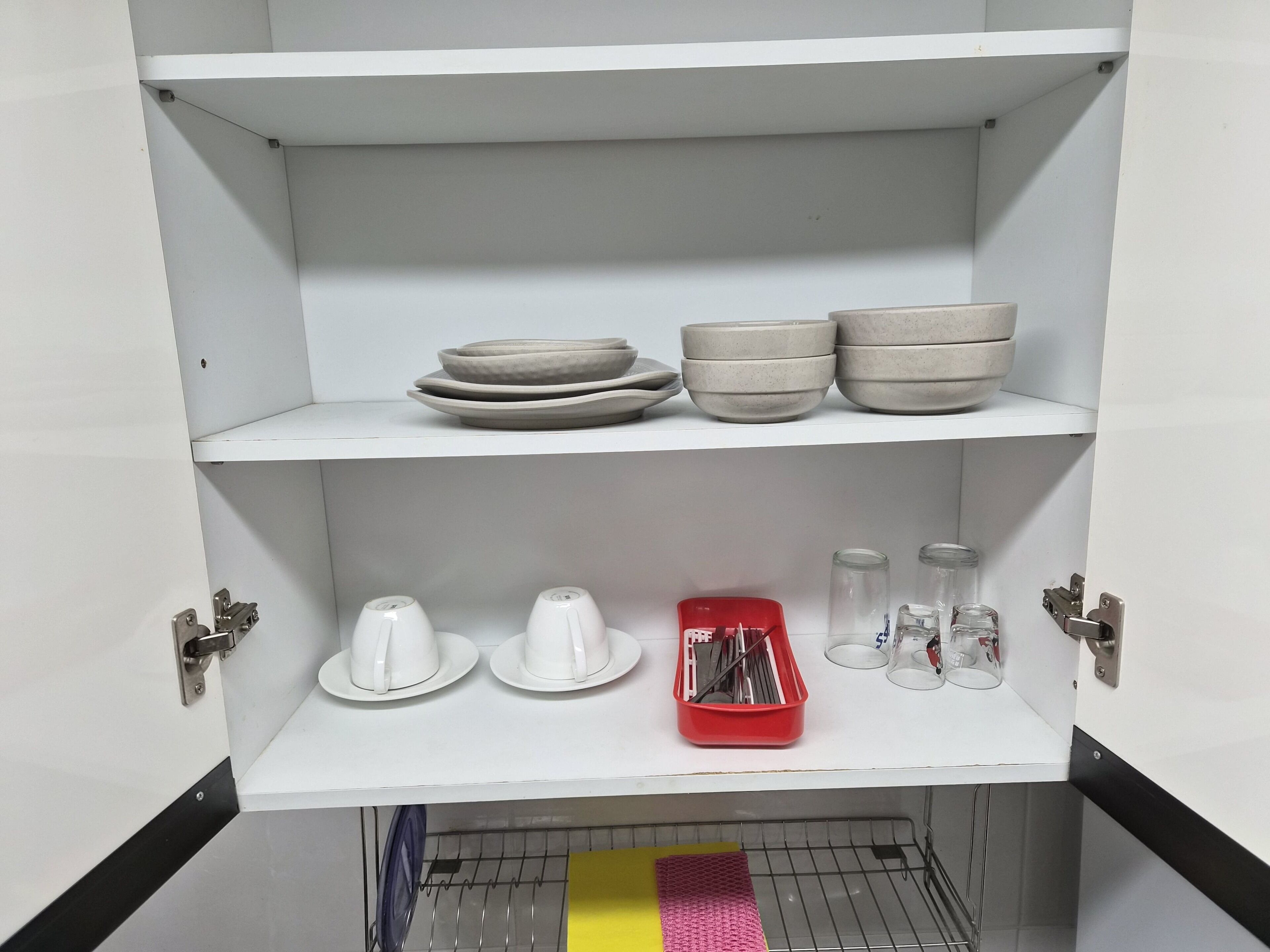 A white shelving unit with multiple compartments.