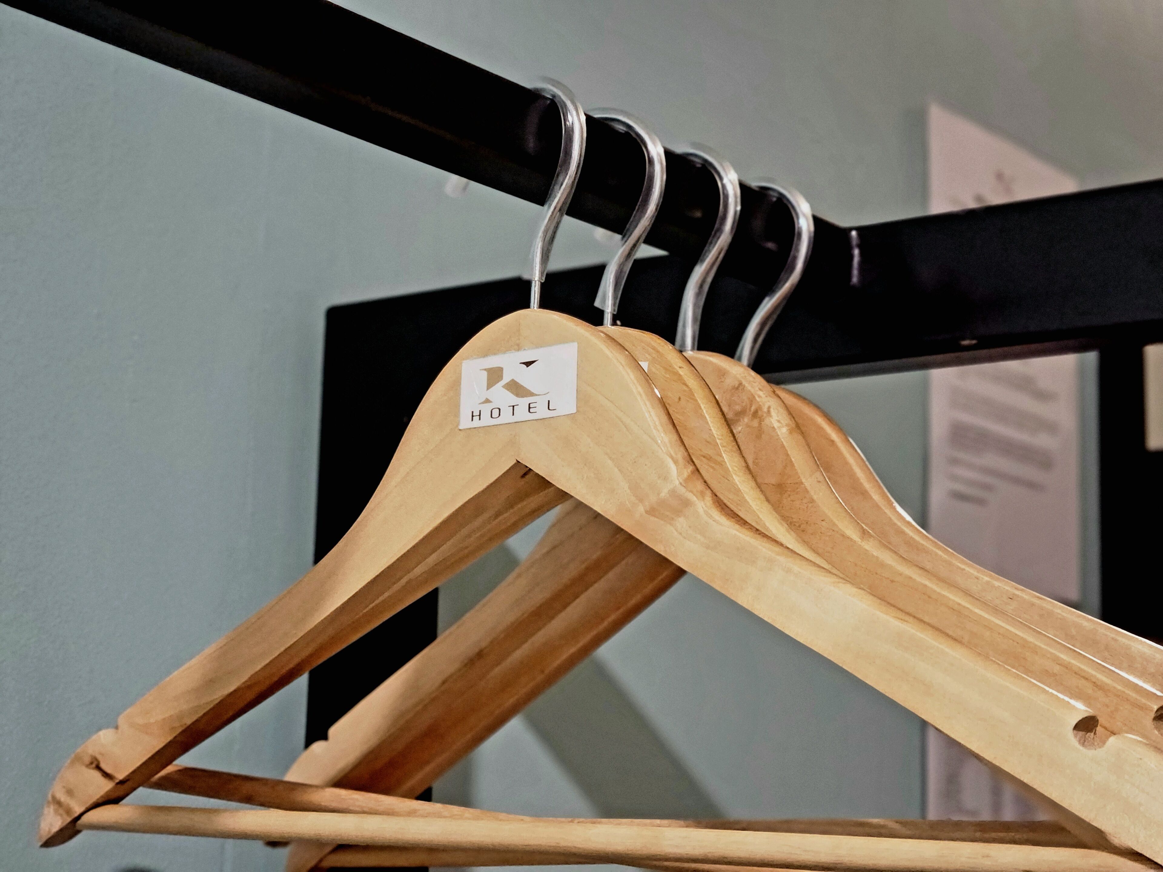 desk, iron/ironing board, bed sheets