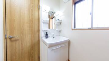 Apartment | Bathroom | Separate tub and shower, free toiletries, hair dryer, slippers