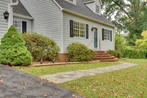 A two-story house with a front porch, a brick foundation, and a well-maintained lawn. - Modern Home w/ Yard + Deck, 1 Mi to Clemson U! (Clemson)